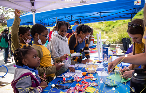 Image of students at a STEM booth